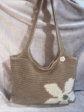The Sak Taupe Crochet Shoulder Bag with White Floral Accent